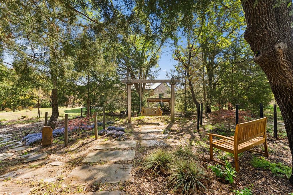 7430 Dawn Avenue Pilot Point, TX 76258 - Photo 35 of 39 a view of a yard with large trees