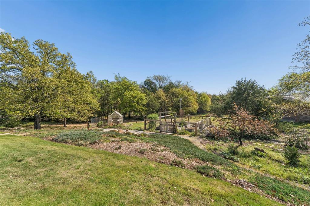 7430 Dawn Avenue Pilot Point, TX 76258 - Photo 38 of 39 a view of a field with trees in the background