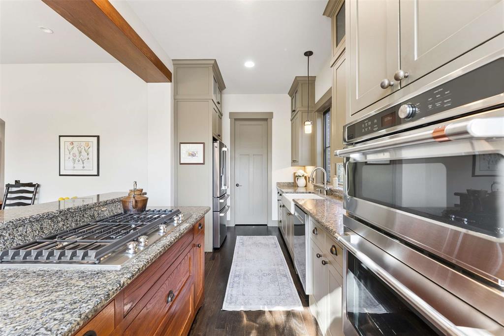 7430 Dawn Avenue Pilot Point, TX 76258 - Photo 9 of 39 a bathroom with a sink and a large mirror