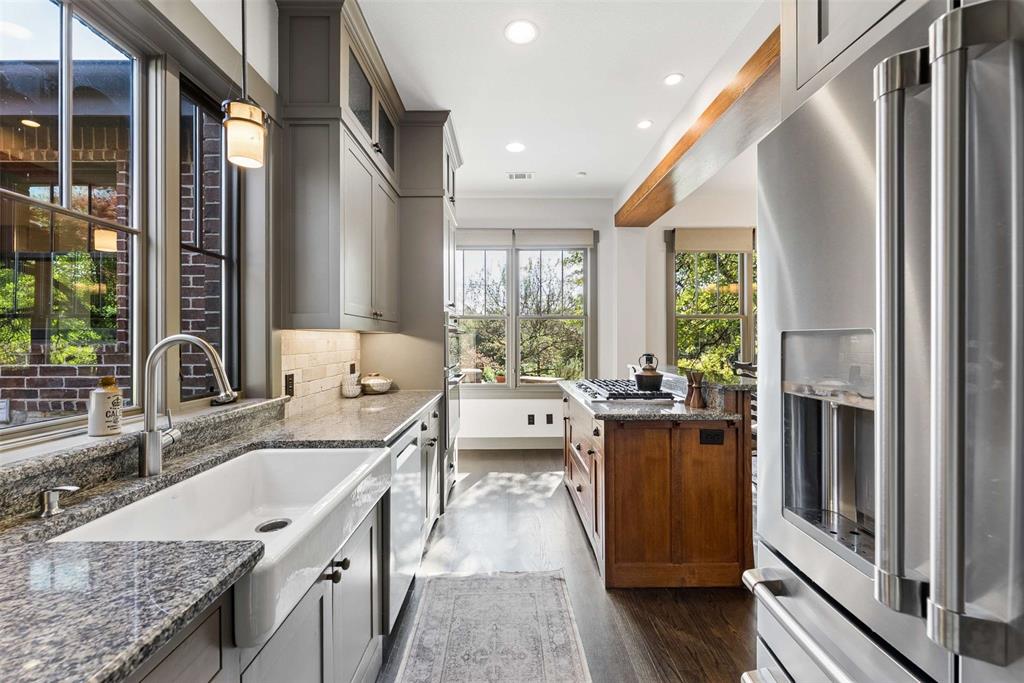 7430 Dawn Avenue Pilot Point, TX 76258 - Photo 10 of 39 a kitchen with stainless steel appliances granite countertop a sink stove and refrigerator