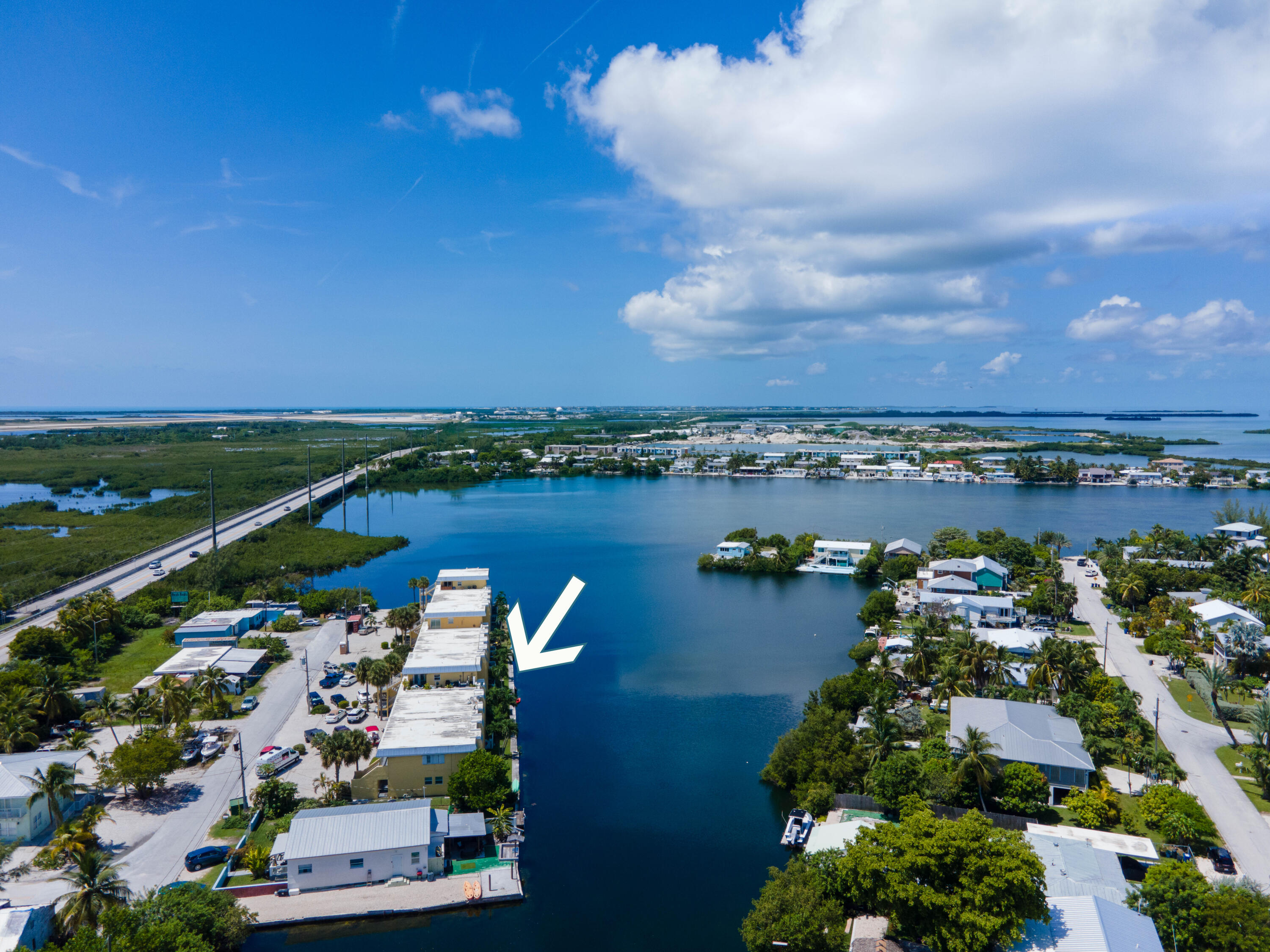 201 Coppitt Road, Unit 104B Key West, FL 33040 - Photo 12 of 12 an aerial view of a city with lots of residential buildings ocean and mountain view in back