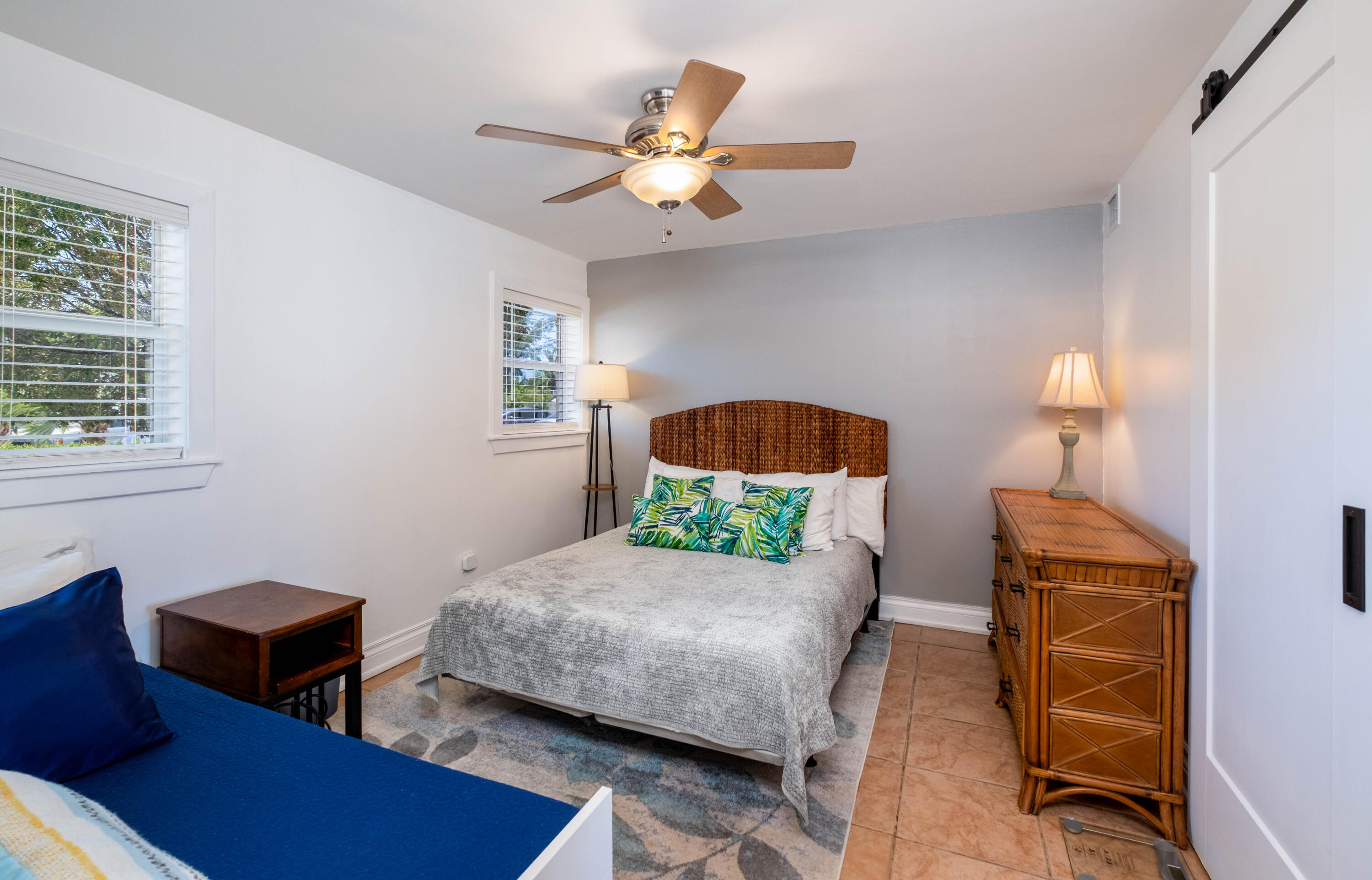 201 Coppitt Road, Unit 104B Key West, FL 33040 - Photo 6 of 12 a bedroom with a bed a couch and dresser