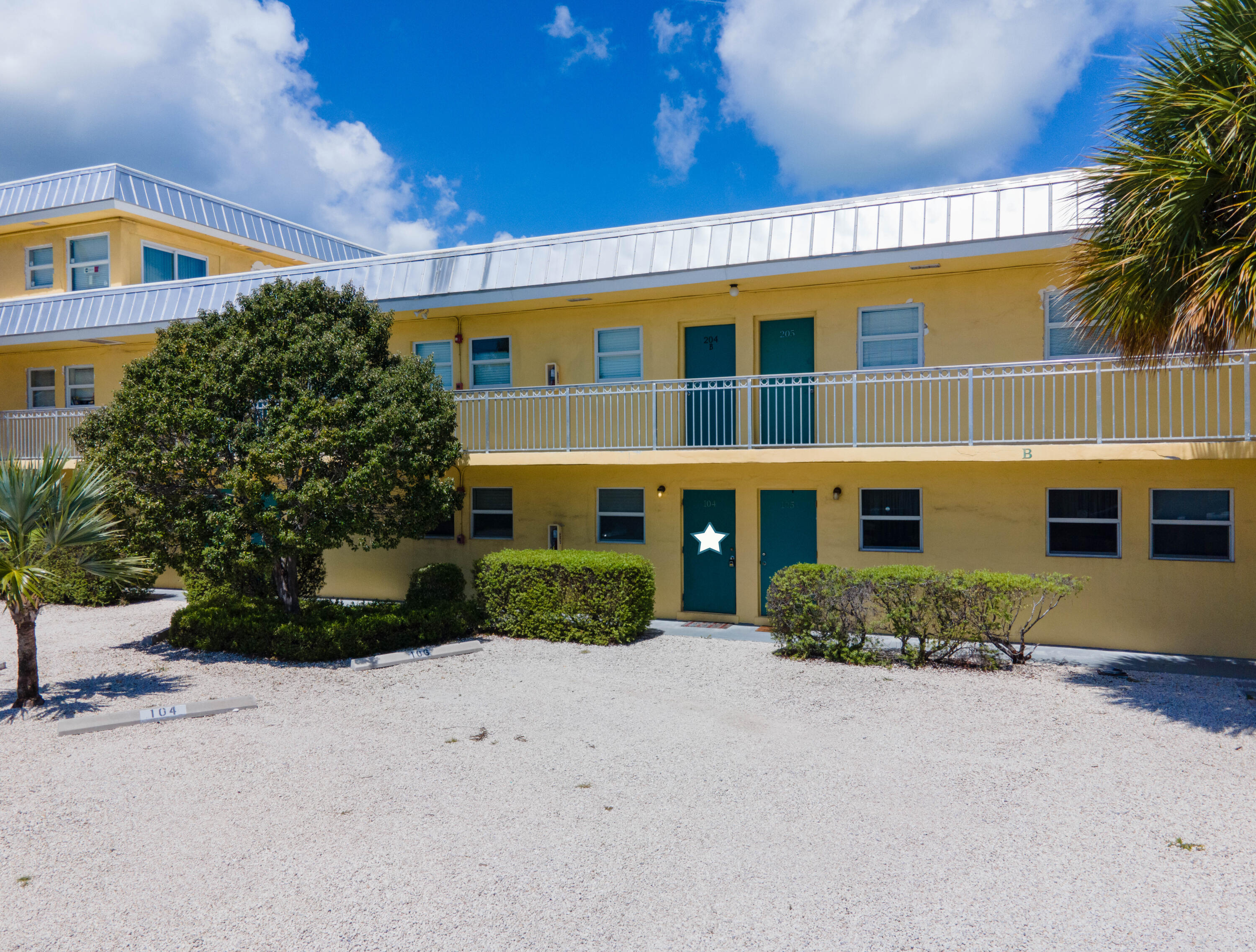 201 Coppitt Road, Unit 104B Key West, FL 33040 - Photo 9 of 12 front view of a house with a yard