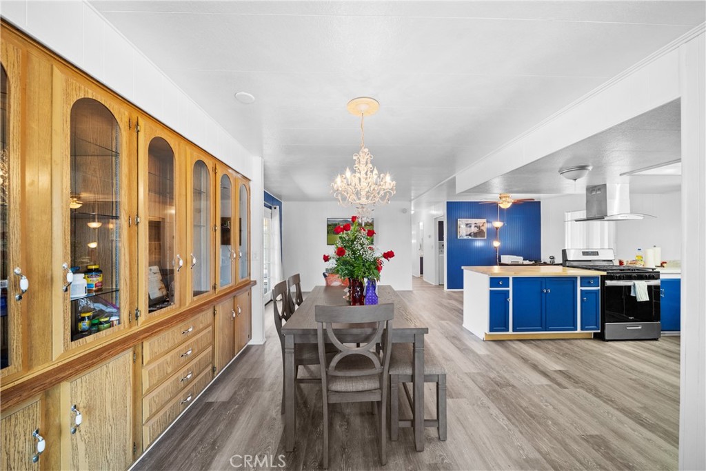 9391 California Avenue, Unit 56 Riverside, CA 92503 - Photo 13 of 45 a large kitchen with a table and chairs