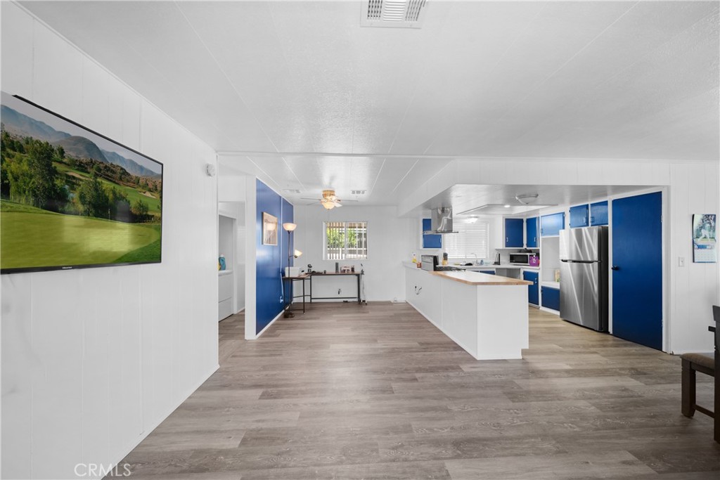 9391 California Avenue, Unit 56 Riverside, CA 92503 - Photo 18 of 45 a view of a kitchen with a sink and a refrigerator