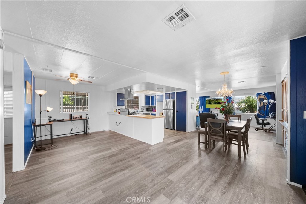 9391 California Avenue, Unit 56 Riverside, CA 92503 - Photo 20 of 45 a living room with furniture and a wooden floor