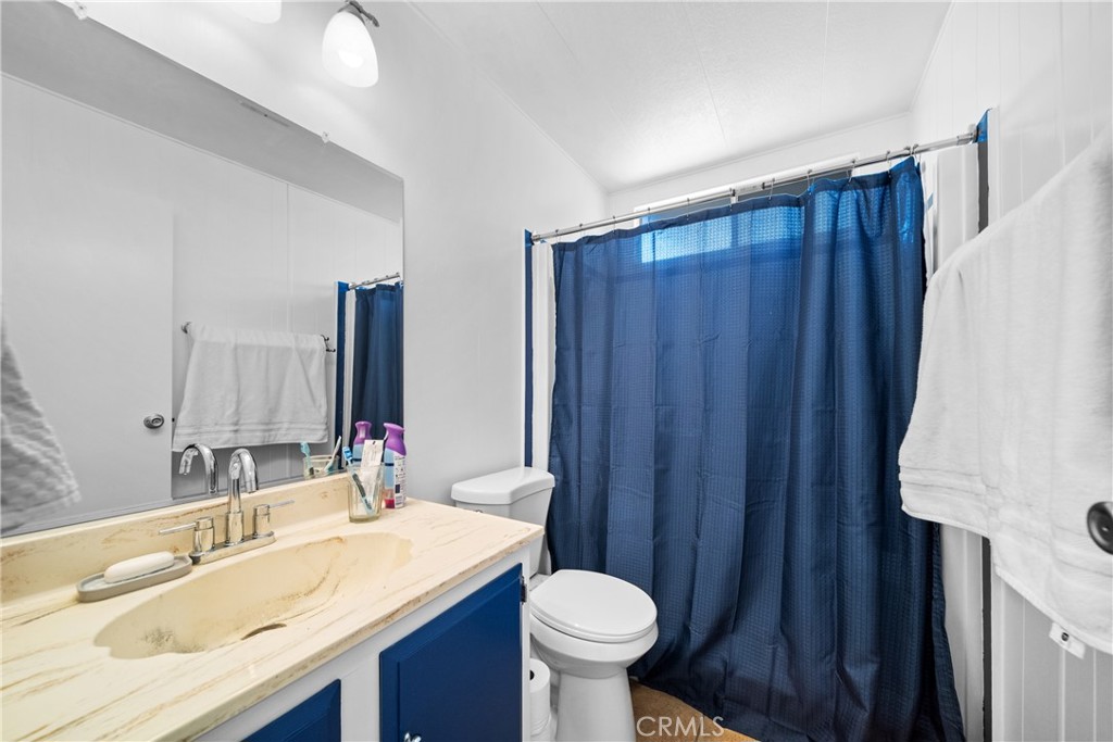 9391 California Avenue, Unit 56 Riverside, CA 92503 - Photo 31 of 45 a bathroom with a sink and a mirror