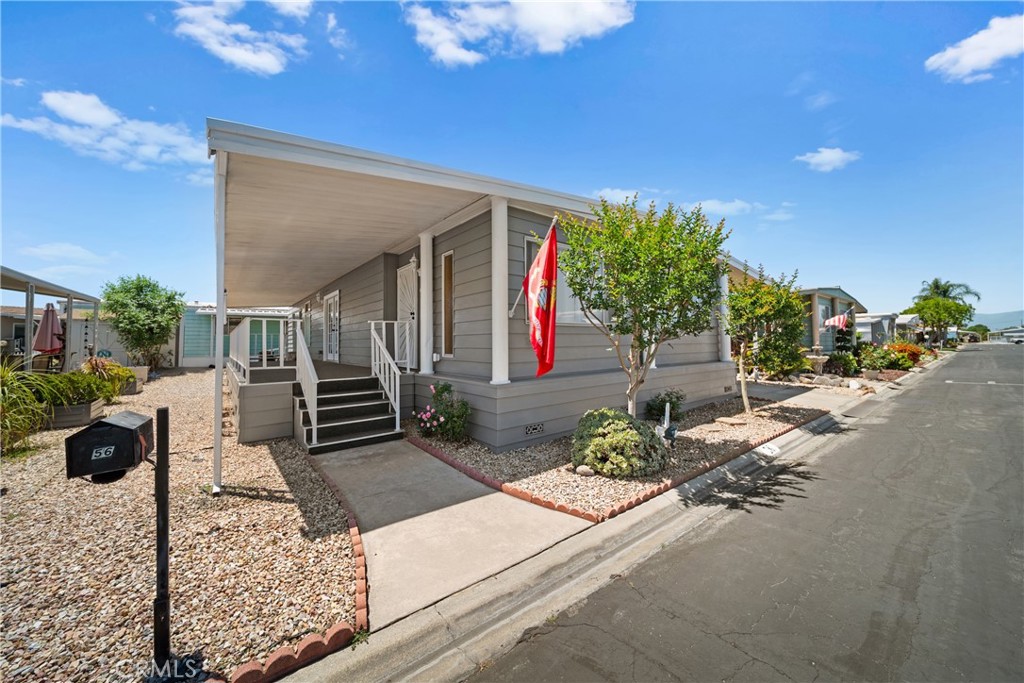 9391 California Avenue, Unit 56 Riverside, CA 92503 - Photo 4 of 45 a house with sign broad in front of it