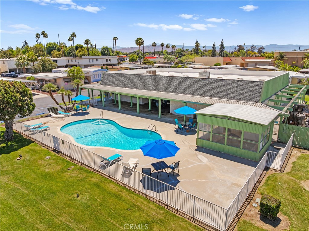9391 California Avenue, Unit 56 Riverside, CA 92503 - Photo 41 of 45 a view of a swimming pool with an outdoor seating