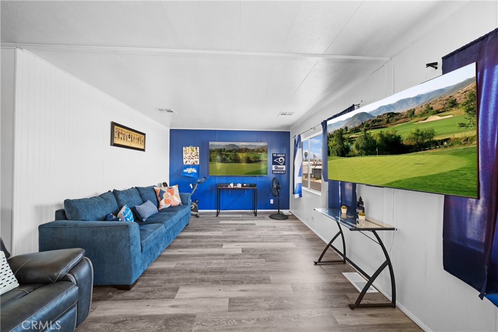 9391 California Avenue, Unit 56 Riverside, CA 92503 - Photo 10 of 45 a living room with furniture and a flat screen tv