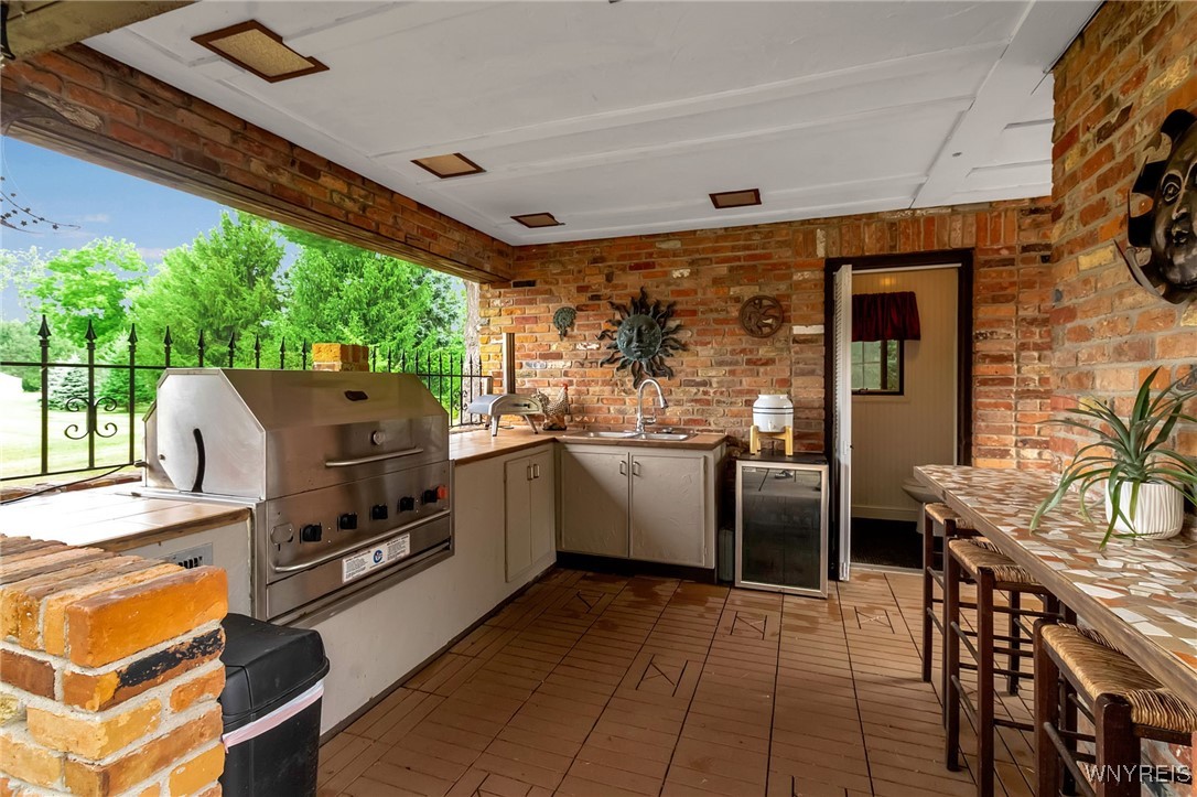 393 Glengrove Road Porter, NY 14174 - Photo 42 of 50 Pool house with sink, grill and refrigerator