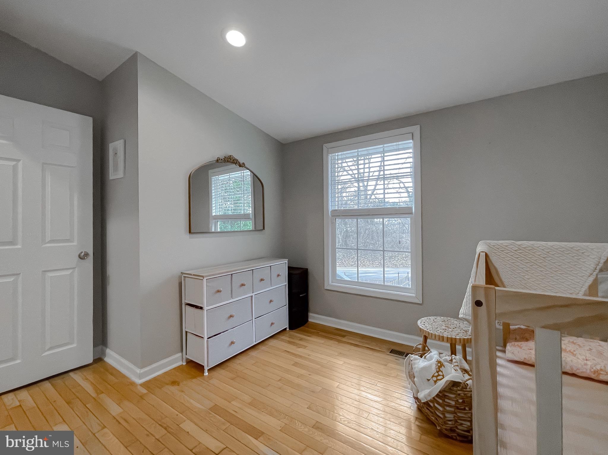 12028 Double Tree Lane Lusby, MD 20657 - Photo 23 of 40 a room with a dresser and a window