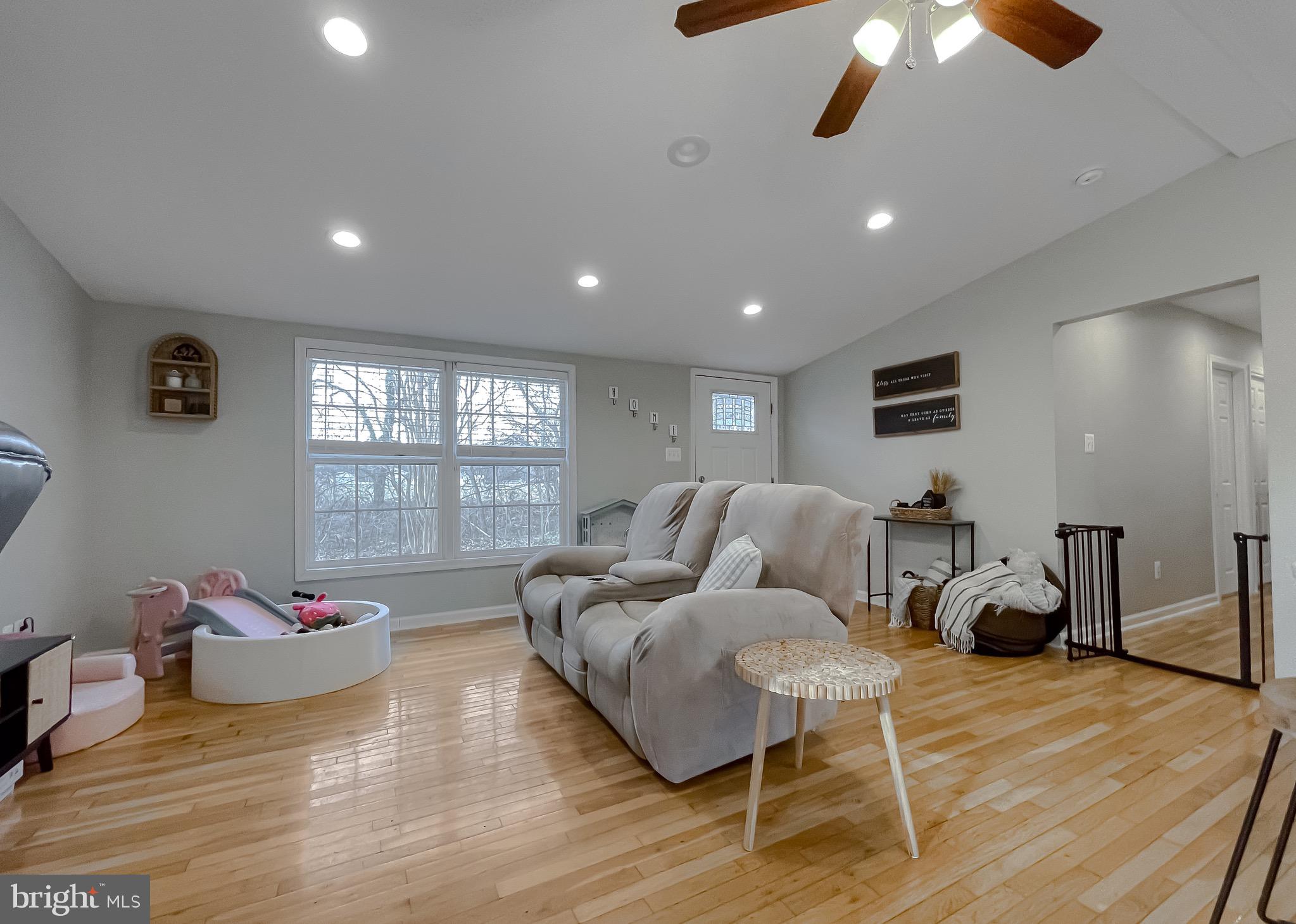 12028 Double Tree Lane Lusby, MD 20657 - Photo 3 of 40 a living room with furniture and a window