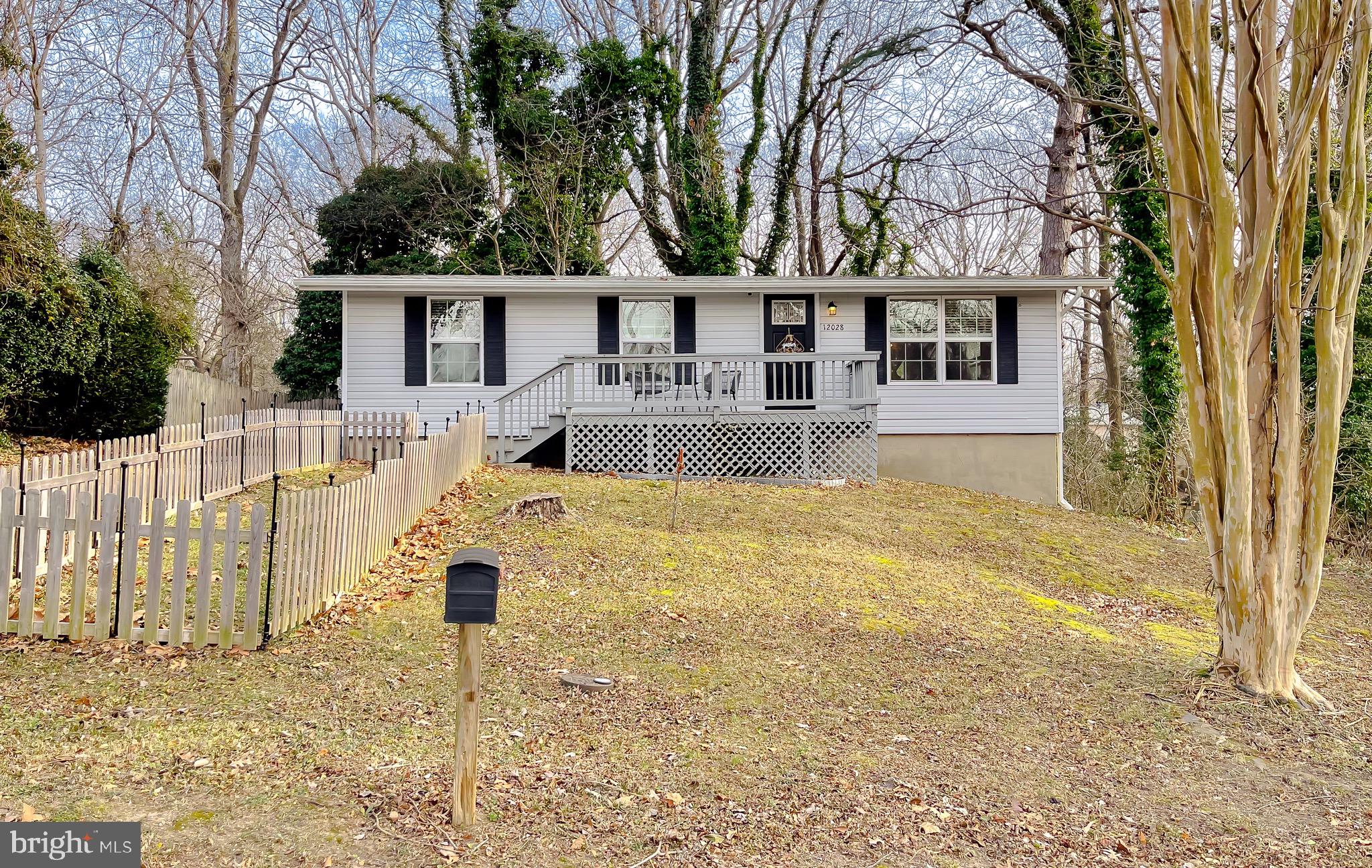 12028 Double Tree Lane Lusby, MD 20657 - Photo 40 of 40 a front view of house with yard and swimming pool