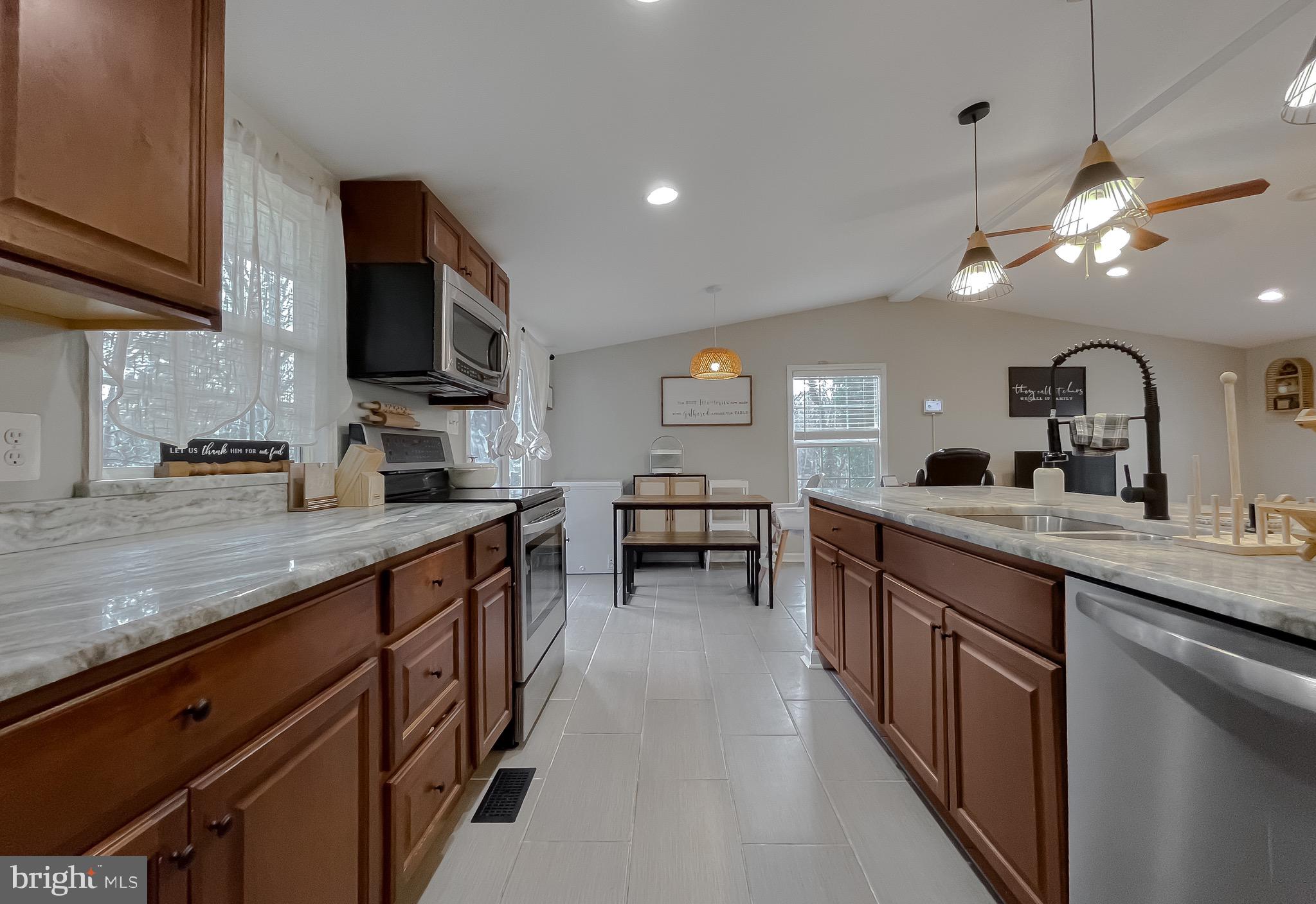 12028 Double Tree Lane Lusby, MD 20657 - Photo 8 of 40 a kitchen with lots of counter space and a sink