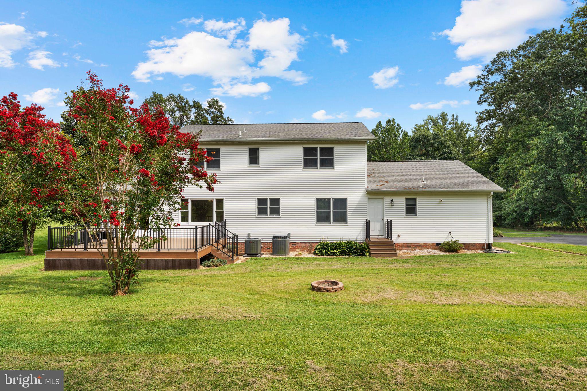 13360 Cameron Court Boston, VA 22713 - Photo 28 of 76 a view of a house with a big yard and sitting area