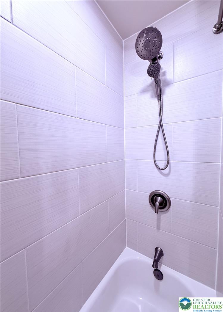 1275 Macada Road Bethlehem, PA 18017 - Photo 47 of 87 Step into a meticulously tiled shower with a modern, convenient dual showerhead system.