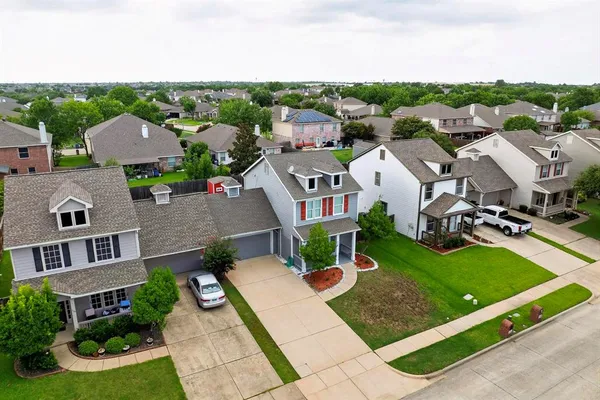 an aerial view of a house with a garden