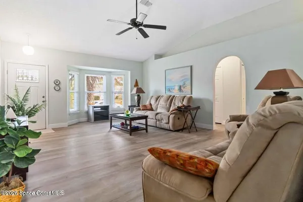 a living room with furniture and a window