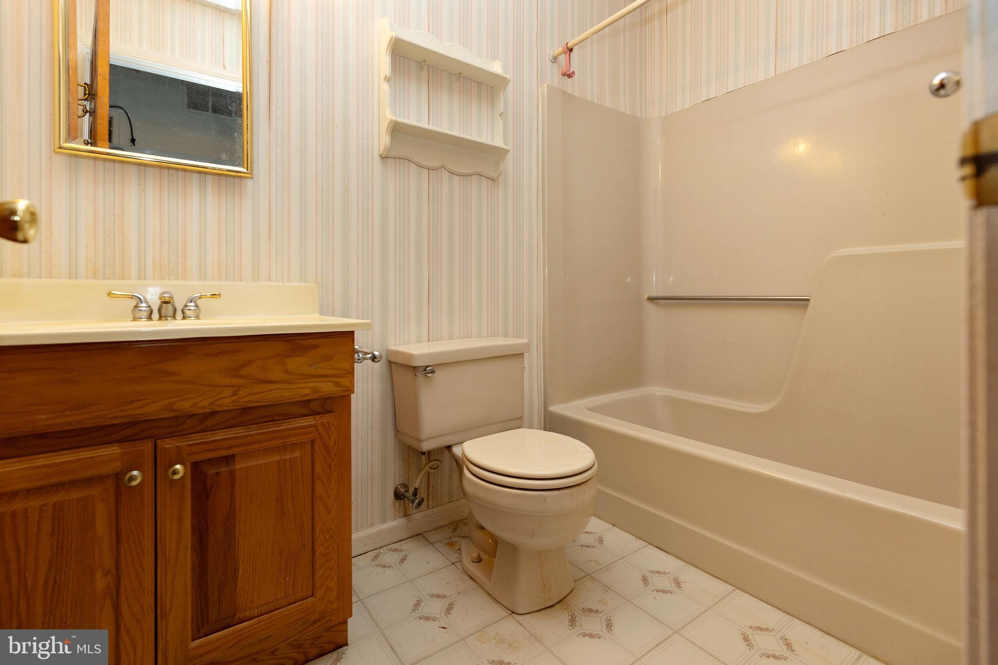 322 West Washington Avenue Magnolia, NJ 08049 - Photo 24 of 28 a bathroom with a sink toilet and shower