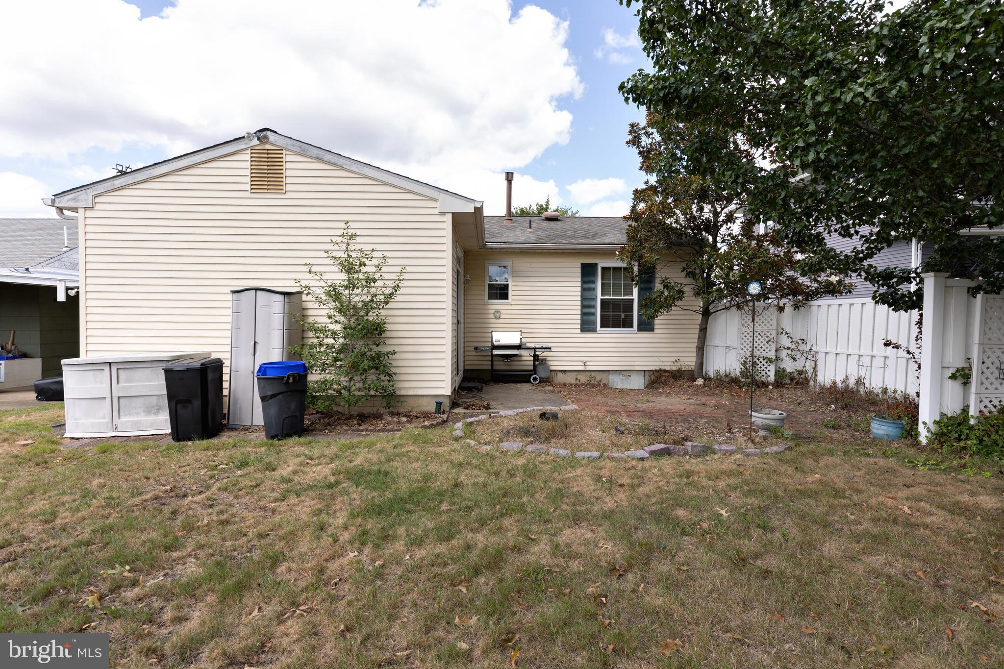 322 West Washington Avenue Magnolia, NJ 08049 - Photo 27 of 28 a view of a house with a yard and garage