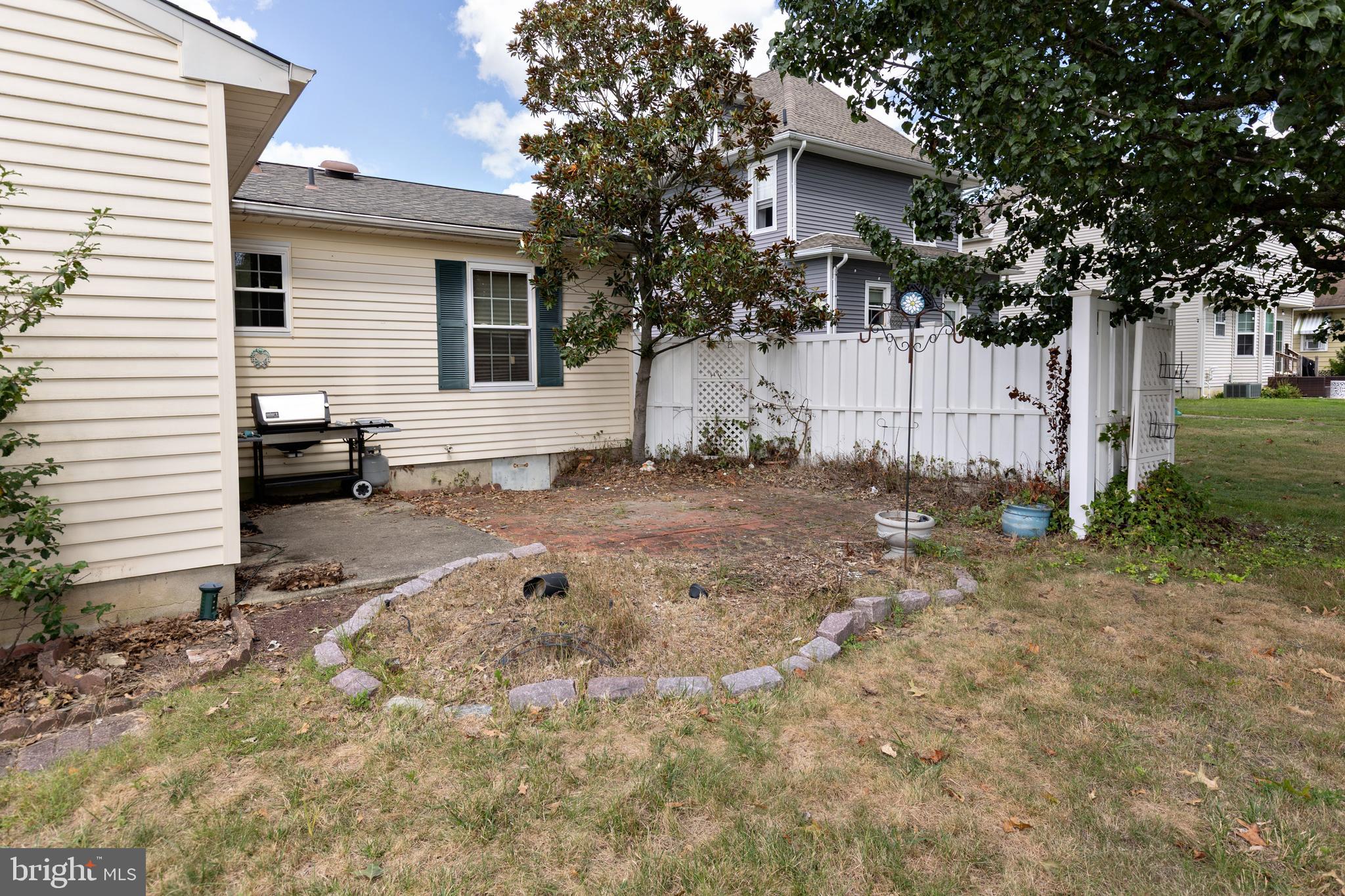 322 West Washington Avenue Magnolia, NJ 08049 - Photo 28 of 28 a view of a house with backyard and trees
