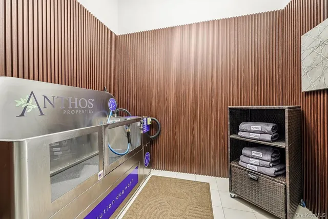 a dining room with furniture and a potted plant