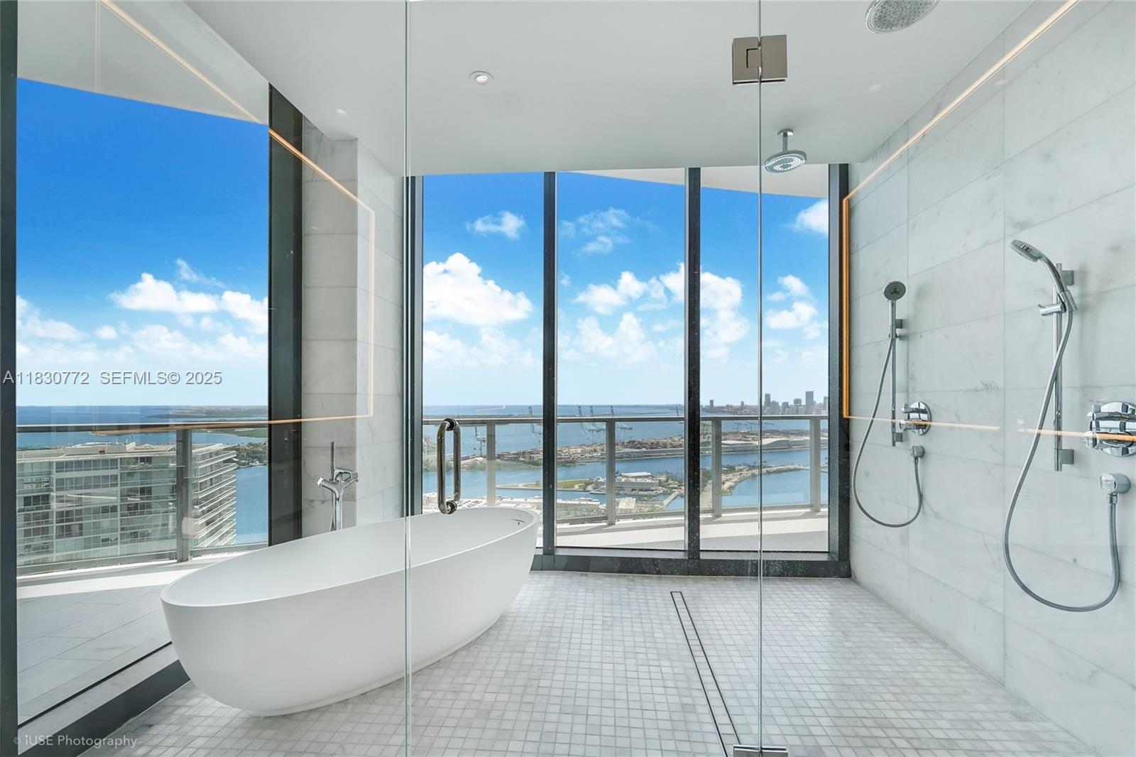 500 Alton Road, Unit 4401 Miami Beach, FL 33139 - Photo 13 of 34 a bathroom with a tub and shower