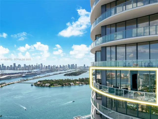 a view of living room with furniture and a fireplace