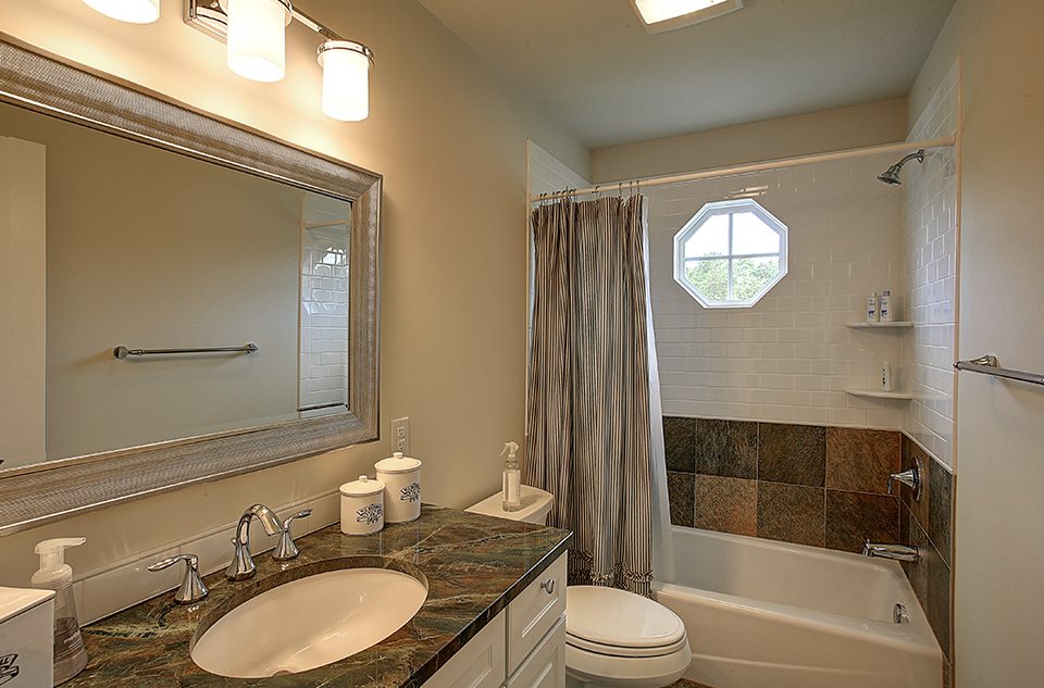 3437 Keswick Road Keswick, VA 22947 - Photo 14 of 19 a bathroom with a sink a toilet and shower