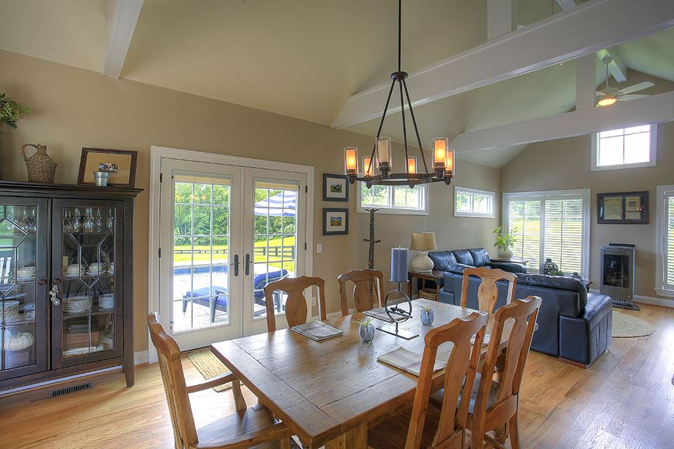3437 Keswick Road Keswick, VA 22947 - Photo 6 of 19 a view of a dining room with furniture window and wooden floor
