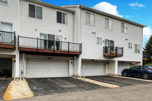 a front view of a house with a garage