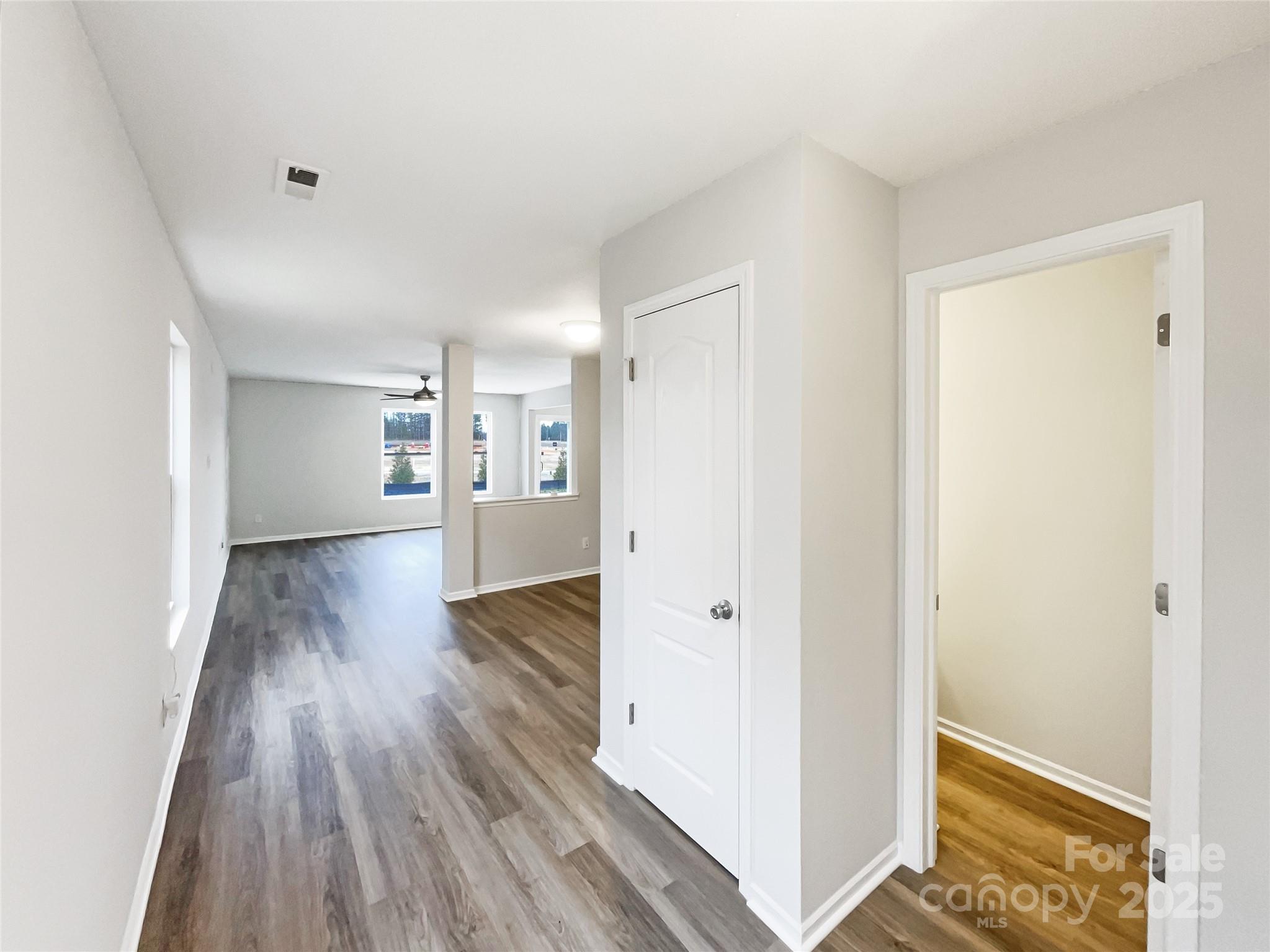117 Hunter Park Drive York, SC 29745 - Photo 12 of 21 a view of a hallway with wooden floor and closet