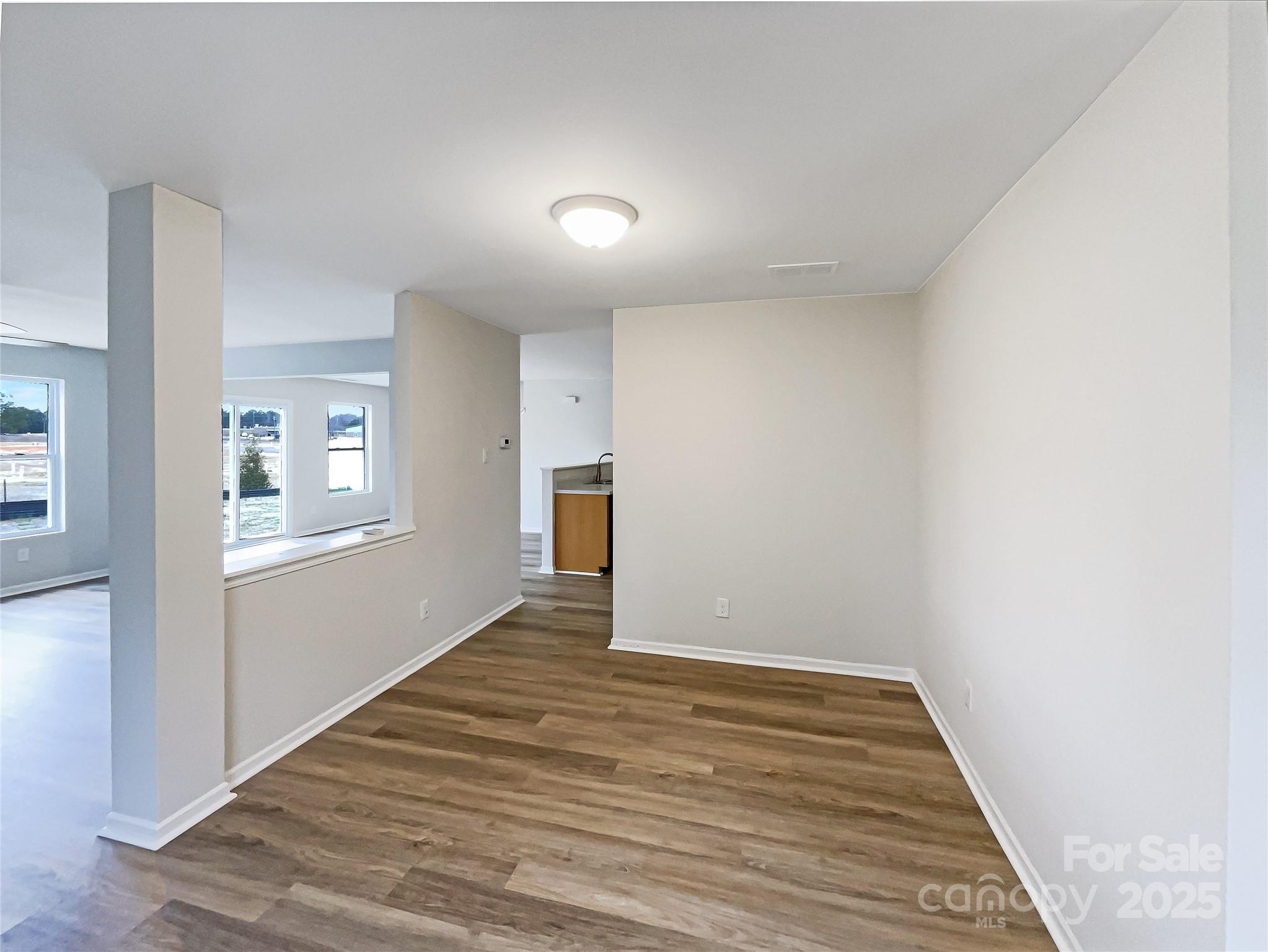 117 Hunter Park Drive York, SC 29745 - Photo 13 of 21 a view of an empty room with wooden floor and a window