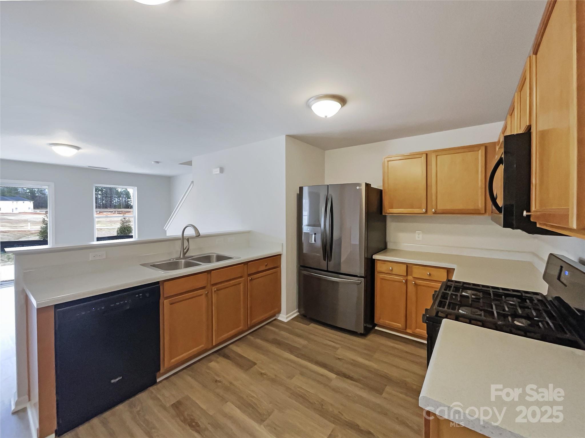 117 Hunter Park Drive York, SC 29745 - Photo 15 of 21 a kitchen with stainless steel appliances granite countertop a sink stove and refrigerator