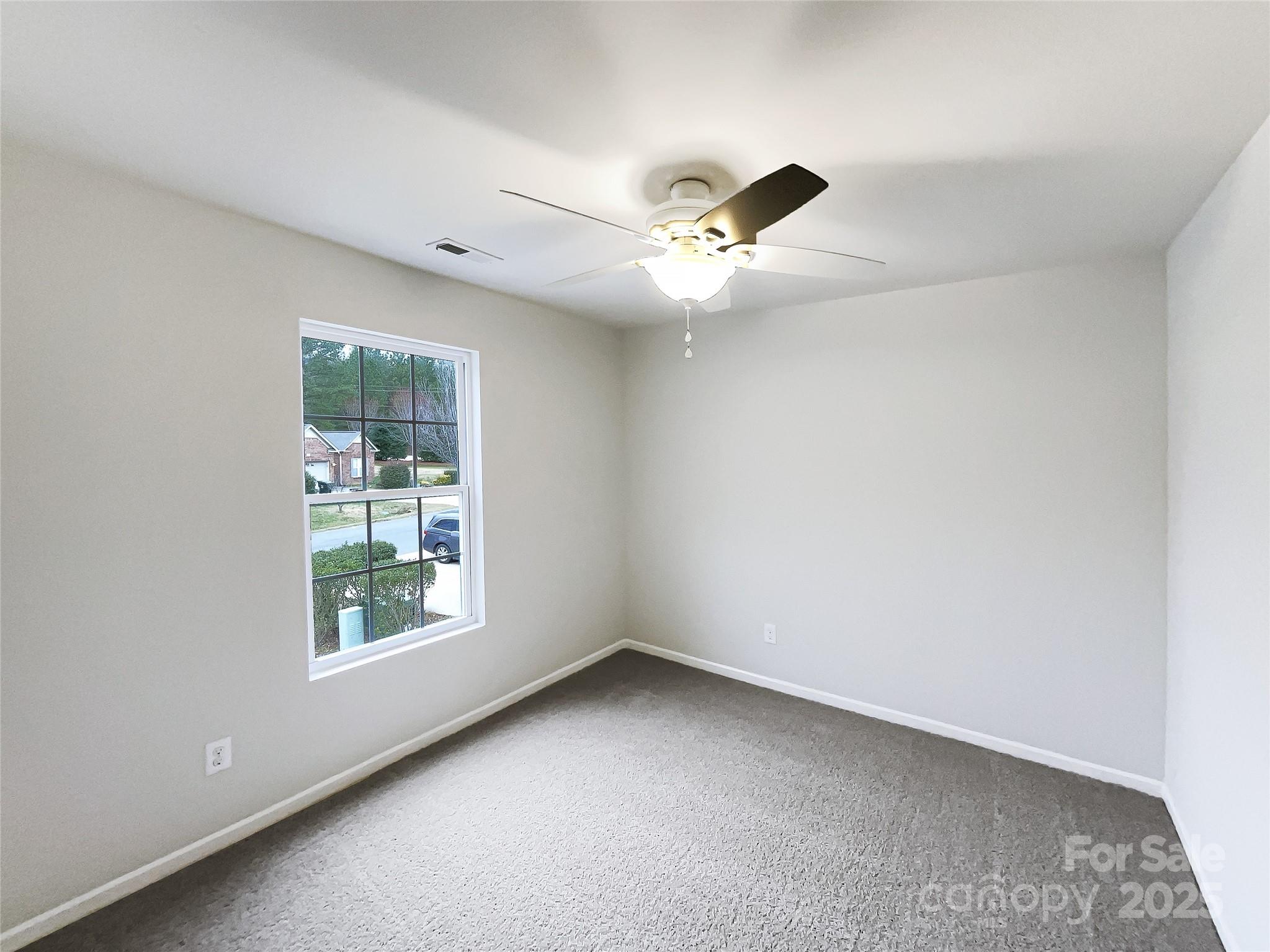 117 Hunter Park Drive York, SC 29745 - Photo 19 of 21 an empty room with windows and ceiling fan