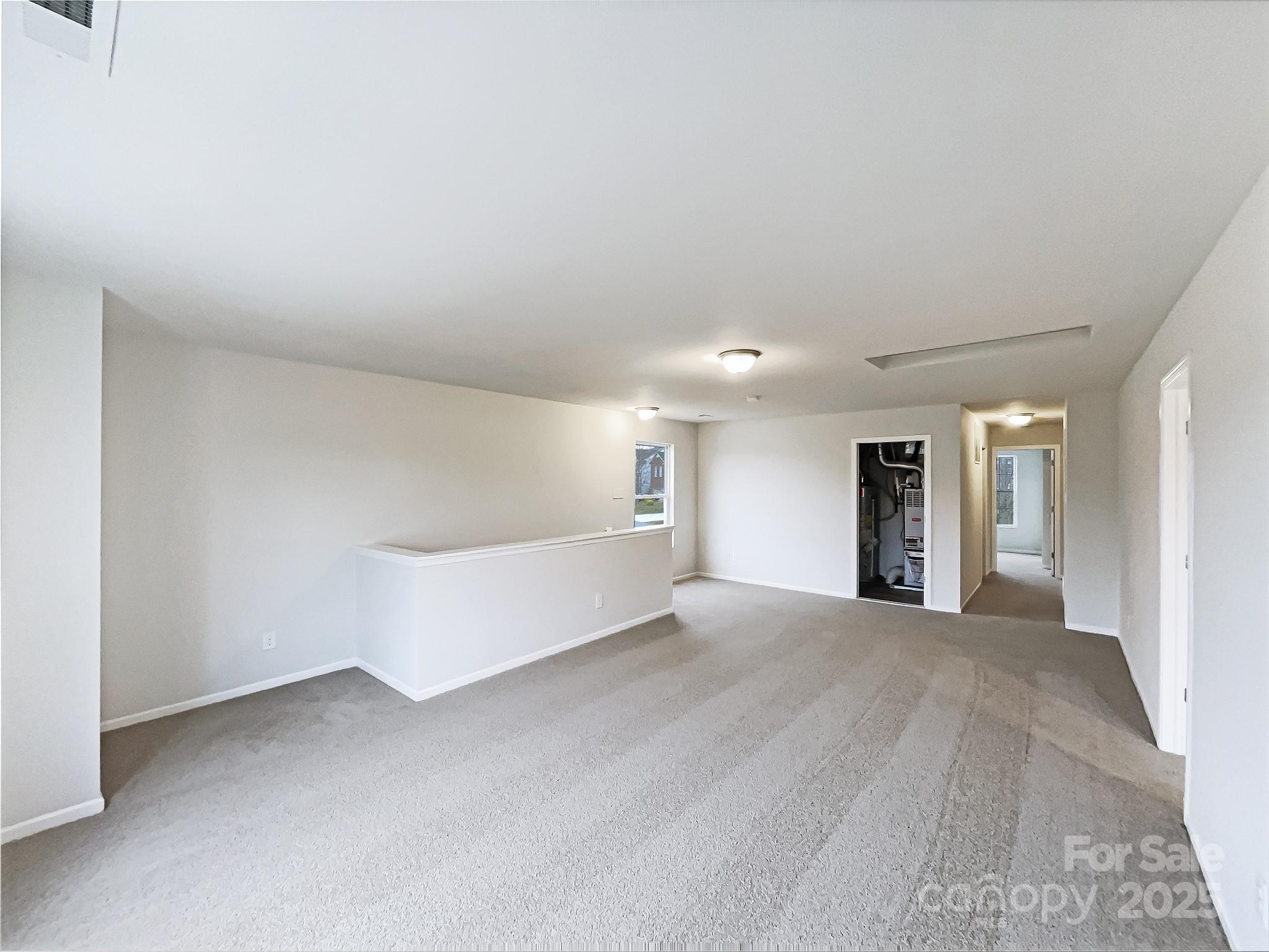117 Hunter Park Drive York, SC 29745 - Photo 20 of 21 a view of an empty room with window and wooden floor