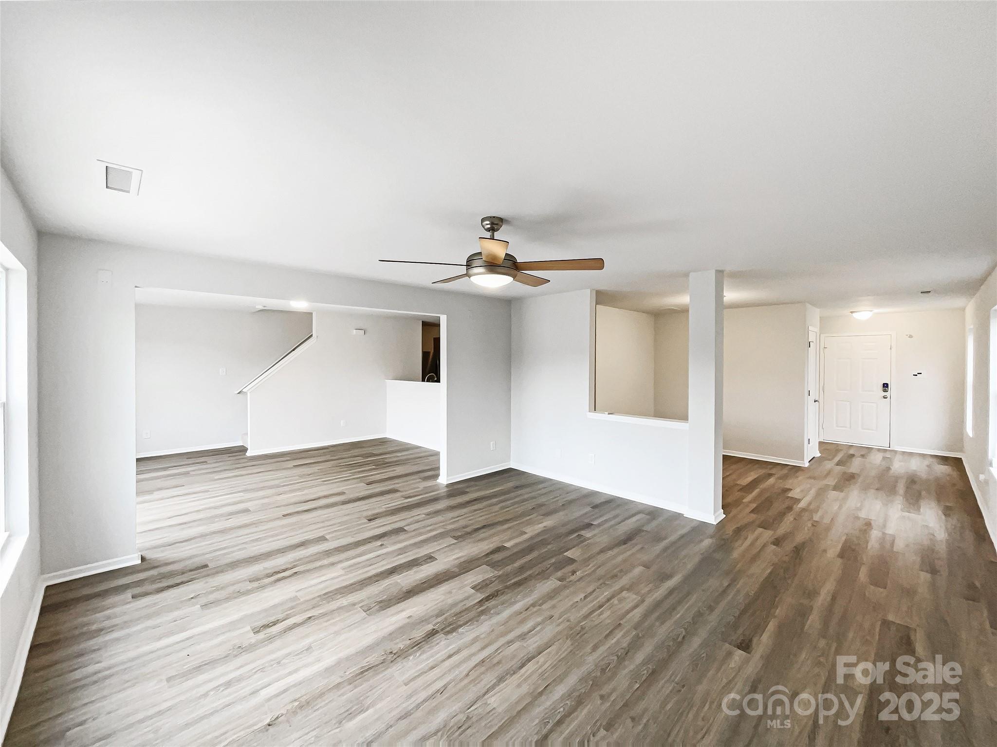 117 Hunter Park Drive York, SC 29745 - Photo 3 of 21 a view of empty room with wooden floor and fan