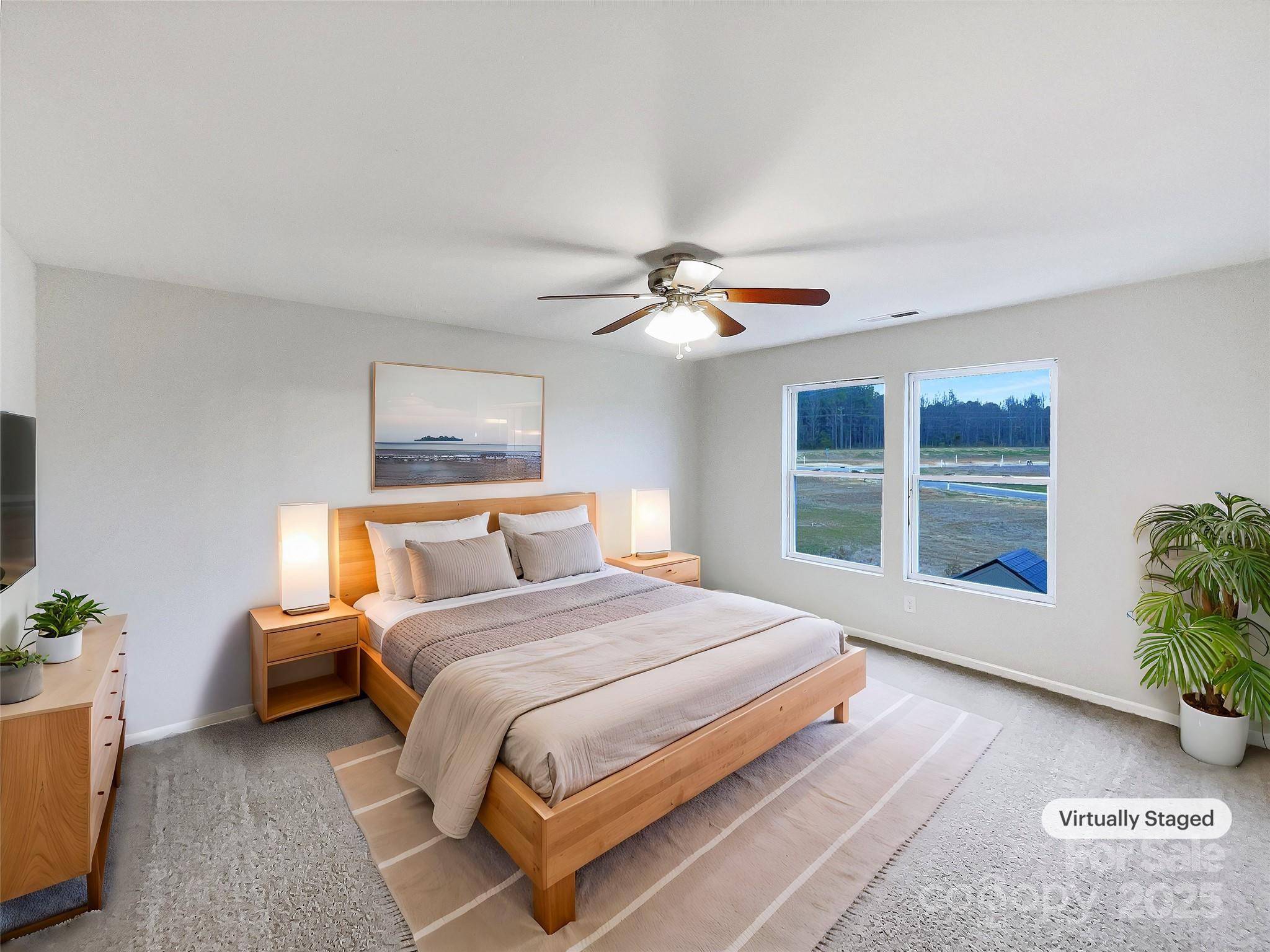 117 Hunter Park Drive York, SC 29745 - Photo 4 of 21 a bedroom with a large bed and a chandelier