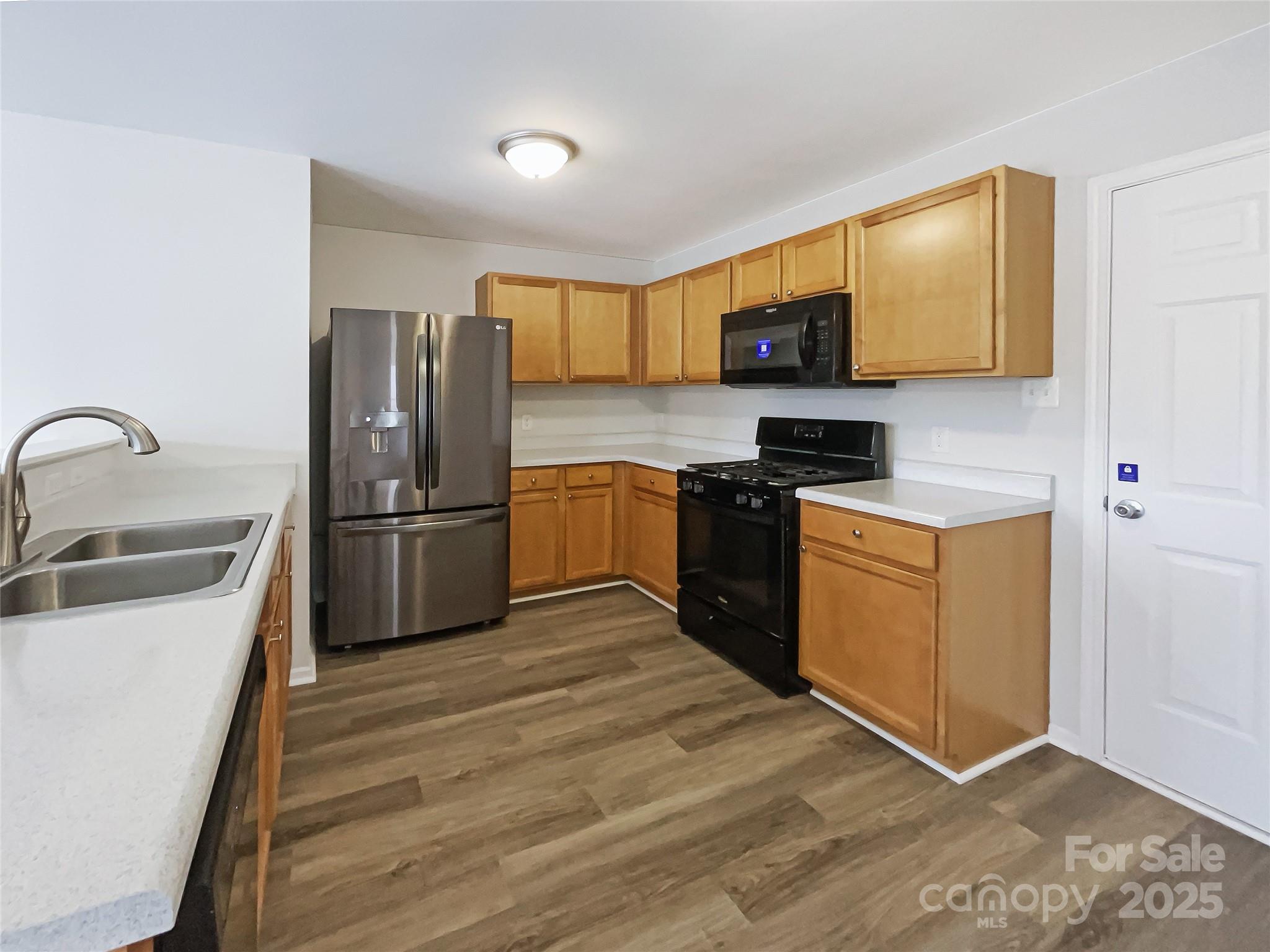 117 Hunter Park Drive York, SC 29745 - Photo 6 of 21 a kitchen with stainless steel appliances granite countertop a refrigerator sink stove microwave and cabinets