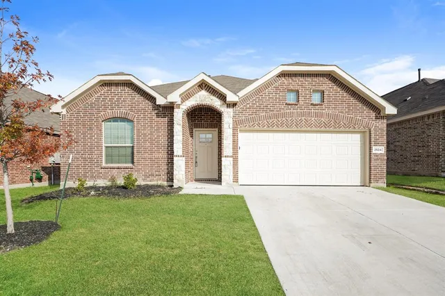 a view of a front of a house with a yard