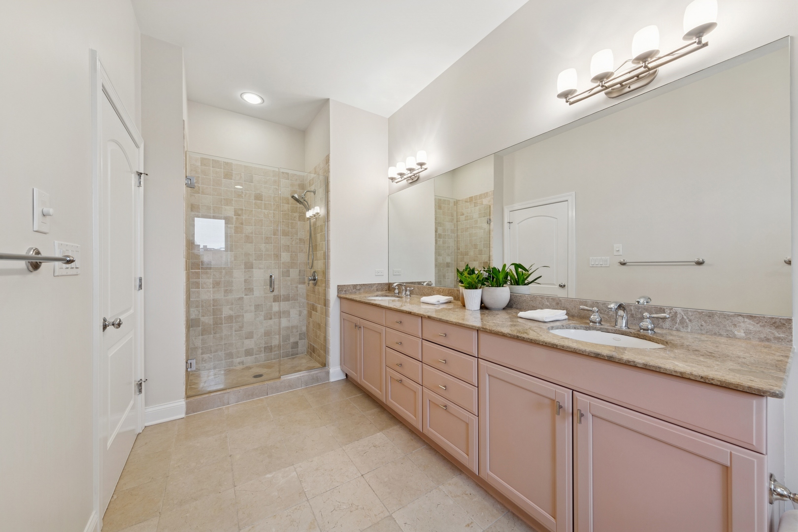 802 West Wolfram Street, Unit 3S Chicago, IL 60657 - Photo 12 of 18 a bathroom with a double vanity sink mirror double and shower