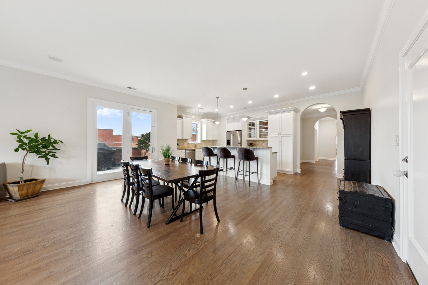 802 West Wolfram Street, Unit 3S Chicago, IL 60657 - Photo 8 of 18 a dining room with furniture and wooden floor