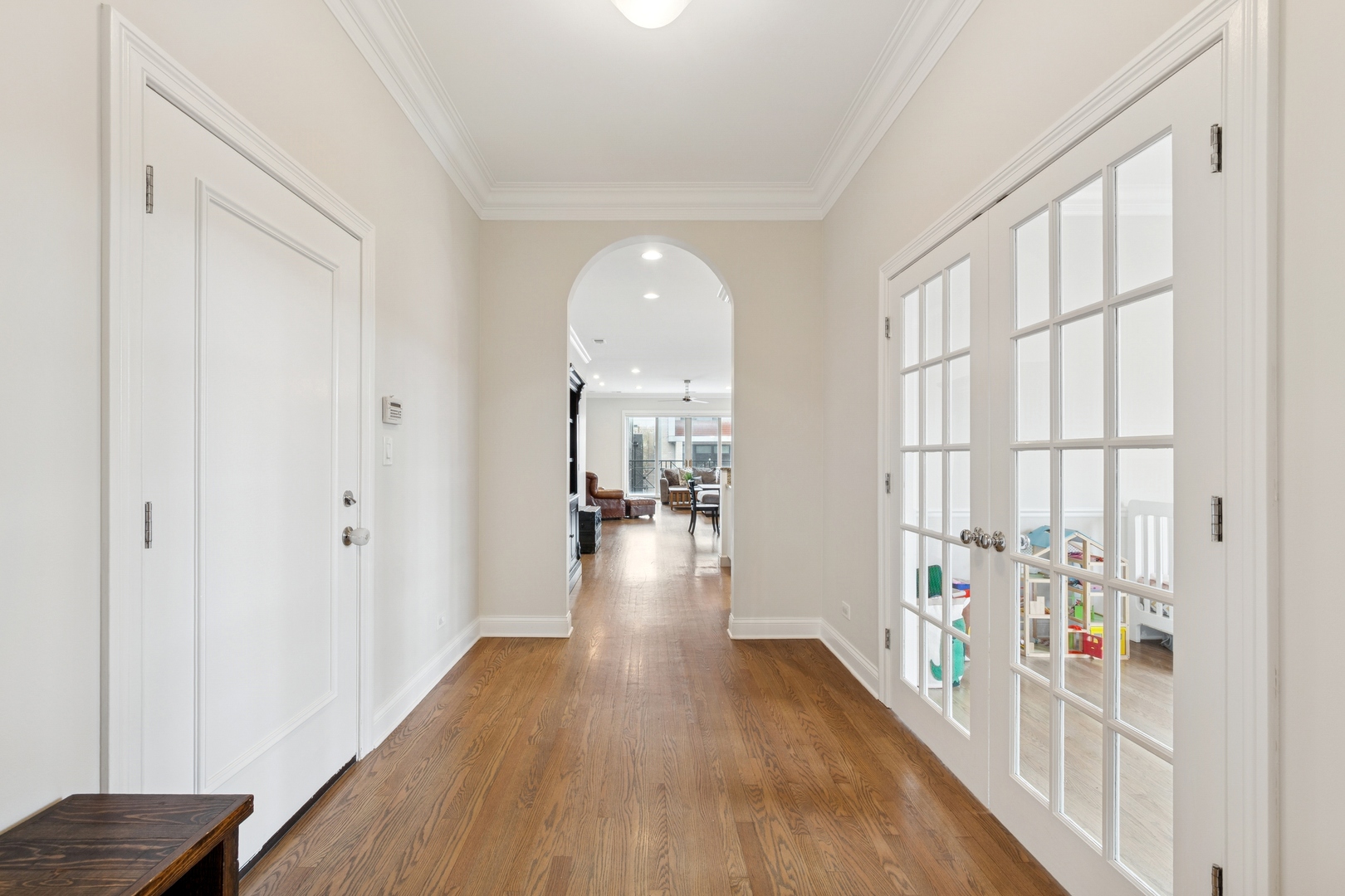 802 West Wolfram Street, Unit 3S Chicago, IL 60657 - Photo 9 of 18 a view of a hallway with wooden floor and a living room
