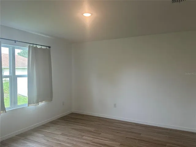 a bathroom with double sink and a mirror