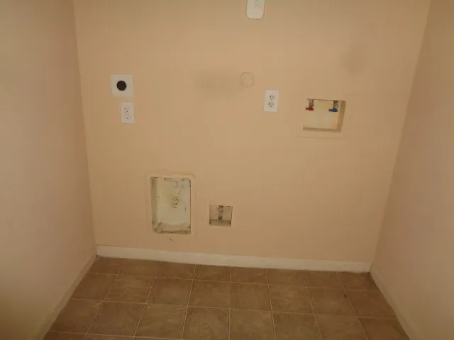 a view of an empty room and closet area