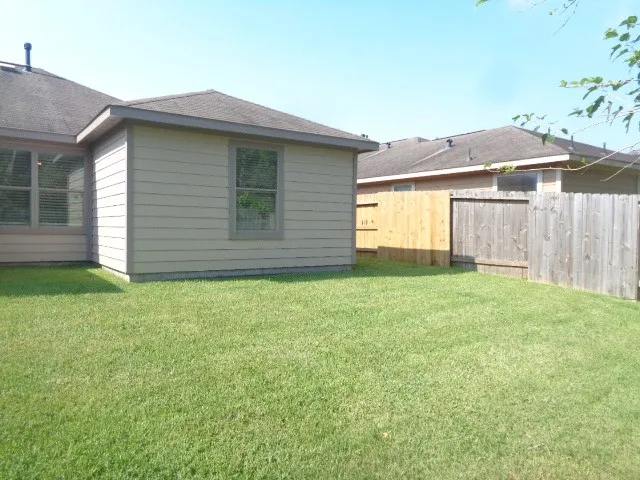 a view of a back yard of the house