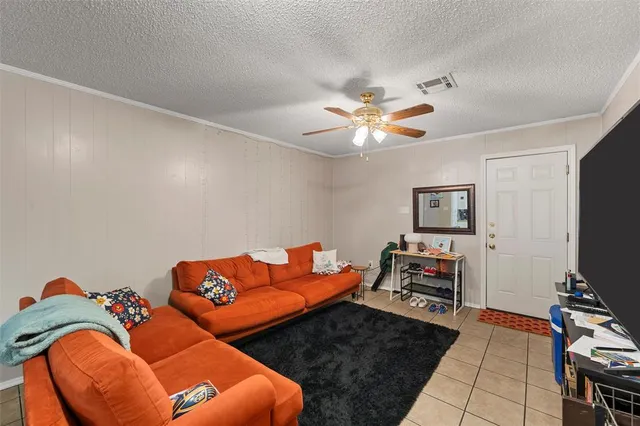 a bed room with furniture and a flat screen tv