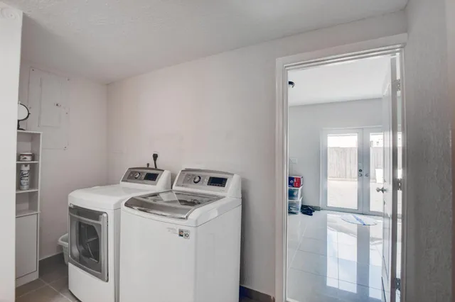 a utility room with dryer and washer
