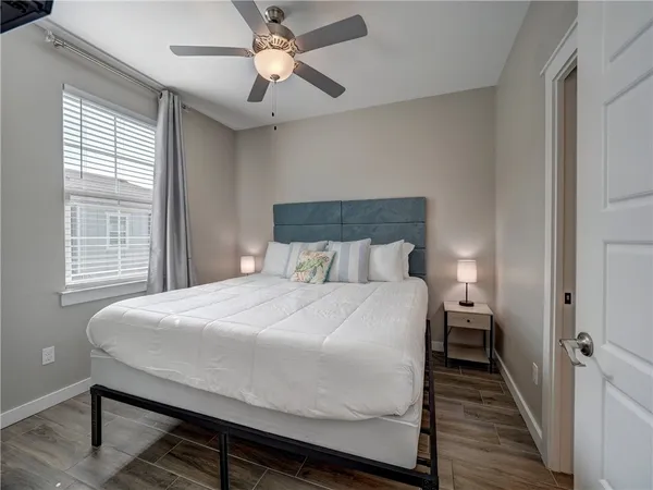 a bedroom with a bed and a window